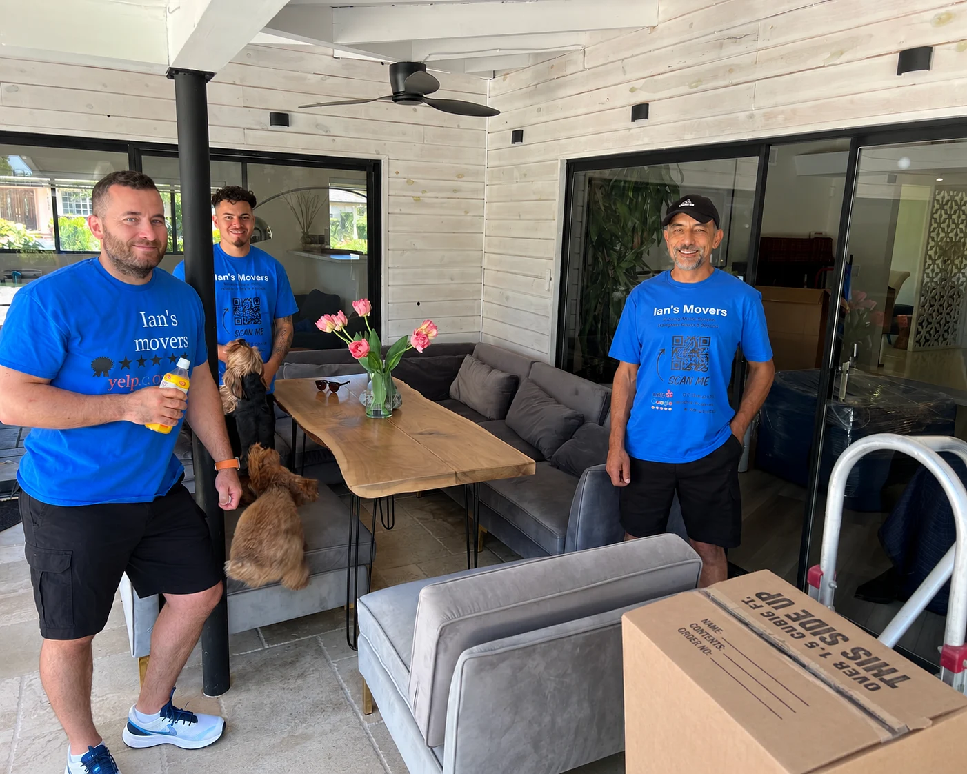 Ian's Movers crew smiling together after a moving job